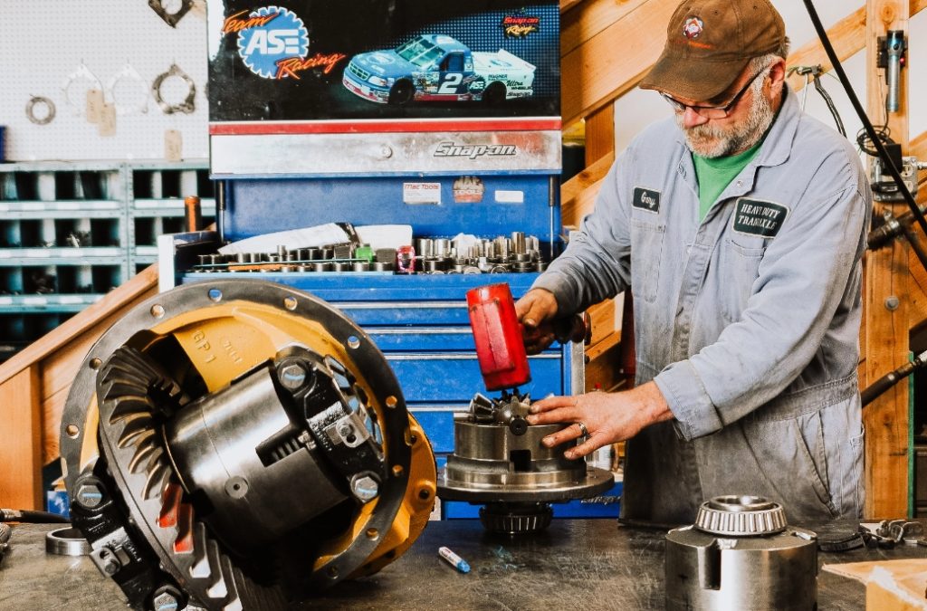 Man working on drivetrain parts - Heavy Duty Transaxle